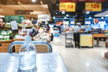 Clear alcohol gel bottles for hand cleaning to prevent the spreading of the corona virus (Covid-19). Place the entrance service for customers before buying in the supermarket.