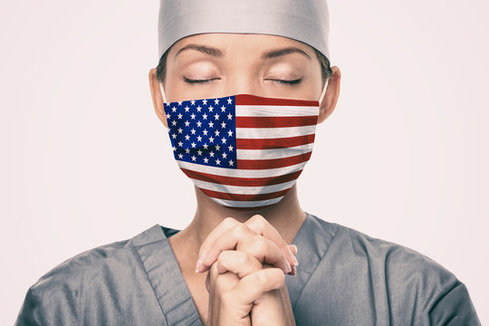 Coronavirus Pandemic In The United States Of America. USA American Flag Print On Doctor's Mask Prayi