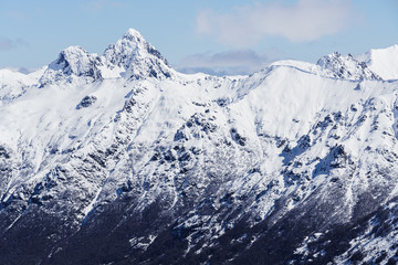 Fototapeta na wymiar Snowy mountain top during winter