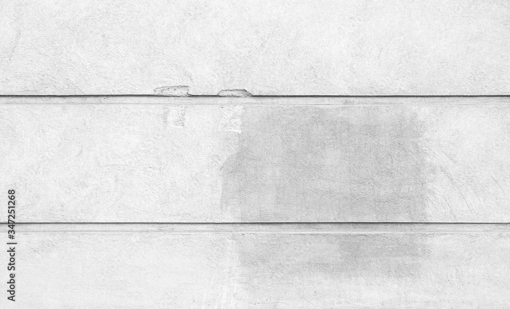 Aufkleber front view of a plastered and damaged gray stone wall with stains from graffiti removal. abstract hi