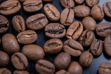 Coffee beans close-up. Beautiful coffee background. Artistic blur.