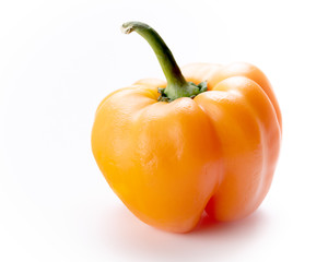 Close up of a single fresh organic orange bell pepper