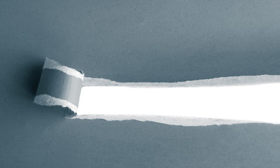 Ripped cardboard with space for text. Torn paper roll with opening showing white background