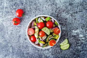 Cucumber tomato avocado red onion salad