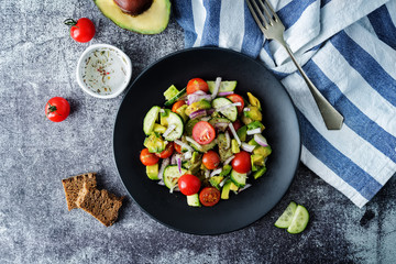 Cucumber tomato avocado red onion salad