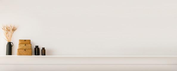 The concept of a bright and cozy interior in Scandinavian style with decorative details and a white wall