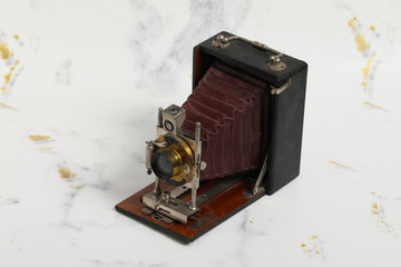 Beautiful turn of the century wooden view camera with red bellows