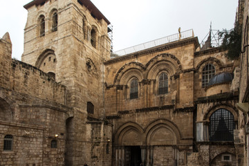 Fototapeta na wymiar Facade of the Basilica of the Holy Sepulcher in Jerusalem, Israel, on which there is a ladde