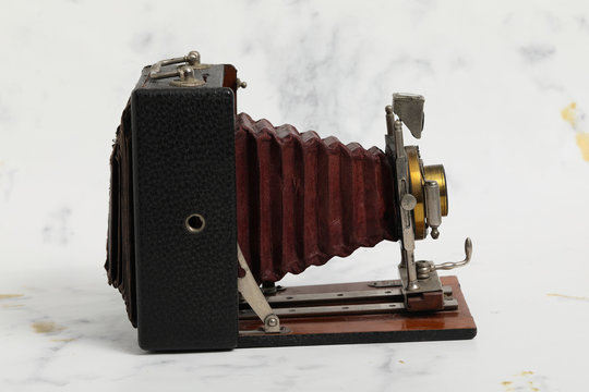 Beautiful turn of the century wooden view camera with red bellows