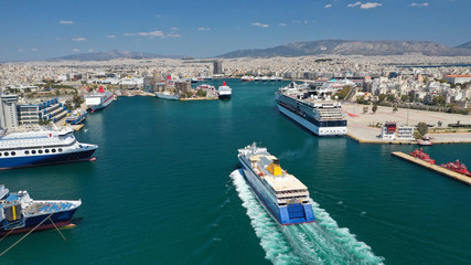 Fototapeta na wymiar Aerial drone photo of passenger ferry reaching destination - busy port of Piraeus, Attica, Greece