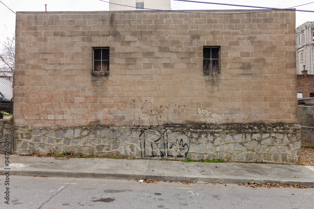 Wall mural side of industrial factory building made of block and brick