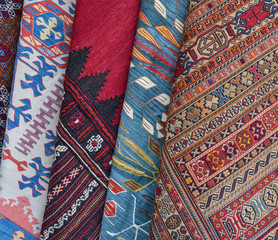 Rows of colourful silk scarfs hanging at a market stall in Istanbul, Turkey