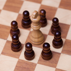 Chess, many against one, the concept of teamwork.