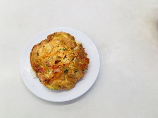 Omelette rice with chopped spring onions topped with sauce
Folk food is simple but delicious and amazing. Just fry the eggs in the pan. Fragrant, inviting eating