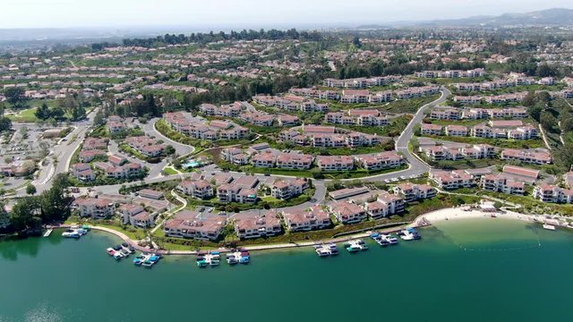 Aerial view of Lake Mission Viejo, with recreational facilities, surrounded by private residential and condominium communities. Orange County, California, USA