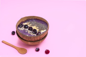 Coconut smoothie bowl with blackberry smoothie, easy recipe with avocado and banana