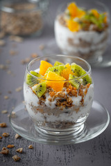 Healthy meal made of granola, yogurt and fruits. Delicious food for breakfast.	