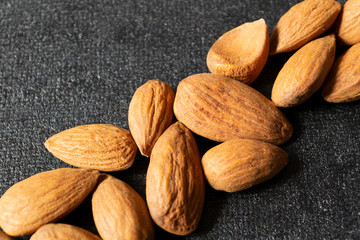 almonds on a black and grey background