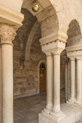 Fototapeta premium BETHLEHEM, Palestine - January 28, 2020: The gothic corridor of atrium at St. Catharine church