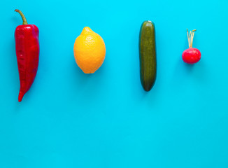Flat lay top view of fresh vegetables over pastel blue backdrop with minimal style, copy space