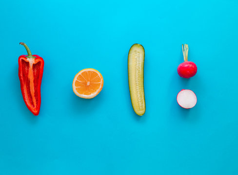 Flat lay top view of fresh vegetables over pastel blue backdrop with minimal style, copy space © Solidasrock