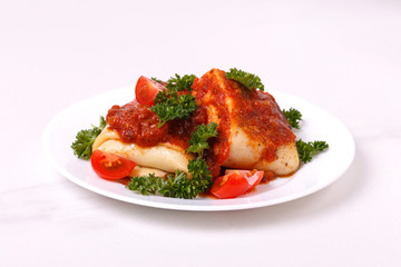 traditional Mexican cuisine chimichanga. Corn cake with minced meat, pepper, onion, garlic, oregano and marinara sauce