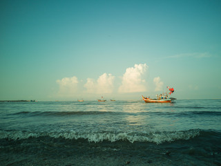 Obraz premium Fishing boats on the sea with blue sky background.