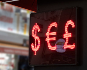 Dollar, euro, pound symbols on led signboard. Close-up.