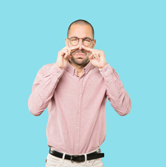Concerned young man with a gesture of disgust