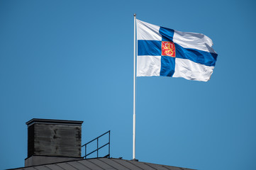 State flag of Finland waiving in the wind.