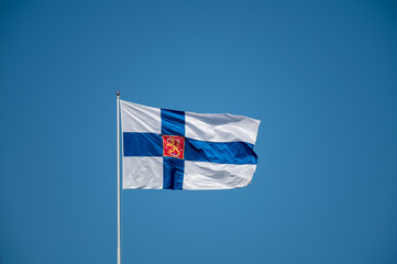 State flag of Finland waiving in the wind.