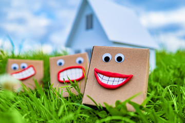 Boxes near the house. Delivery of goods concept. Delivery of goods to the door. Delivery from the online store. Buying goods over the Internet. Postman. The courier left the parcels at home.