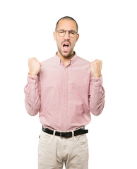 Upset young man doing a competitive gesture