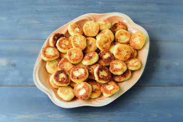 Cheesecakes or Syrniki on a plate. Russian and Ukrainian Cuisine