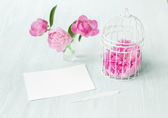 Small bird cage with peony flower bouquet, invitation card template with text space, Shabby Chic Provence Interior.