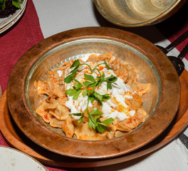 Manti is an extraordinary dish from Turkey: tiny lamb-stuffed dumplings topped with three sauces