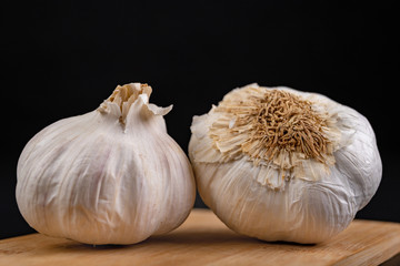 Healthy garlic on a wooden board. Natural methods to prevent colds.