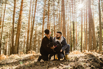 Gay couple in love at the forest