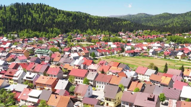 Croatia, town of Delnice, mountain landscape, panoramic view of town center from drone in spring