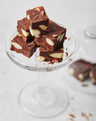 Chocolate dessert with almonds on a bright background