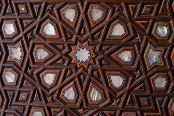 Doors with mother-of-pearl inlay in mosque. Wooden decorative element - turkish pattern