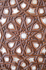 Doors with mother-of-pearl inlay in mosque. Wooden decorative element - turkish pattern