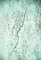 Blue cracked and swollen paint with rust texture. Grunge rusty metal background. Stains of rust.