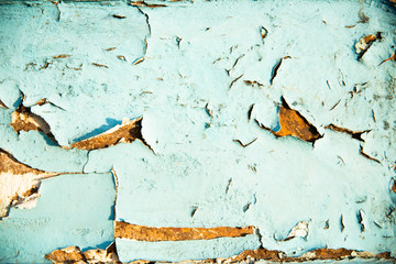 Blue cracked and swollen paint with rust texture. Grunge rusty metal background. Stains of rust.