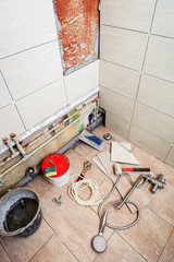 different tools for repair in bathroom