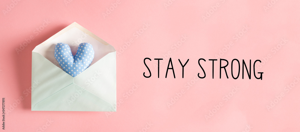 Wall mural Stay Strong message with a blue heart cushion in an envelope - Wall murals