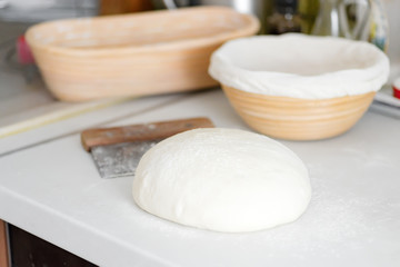 Homemade freshly prepared dough for fresh healthy bakery and pastry on a white kitchen table.