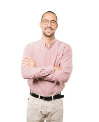 Satisfied young man with crossed arms gesture