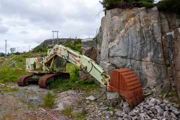 excavator left behind poluting nature