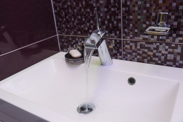 modern faucet in bathroom close up